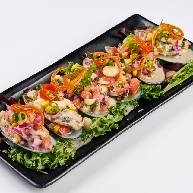 Choritos a la Chalaca (Mussels with Onion and Tomato Salsa).